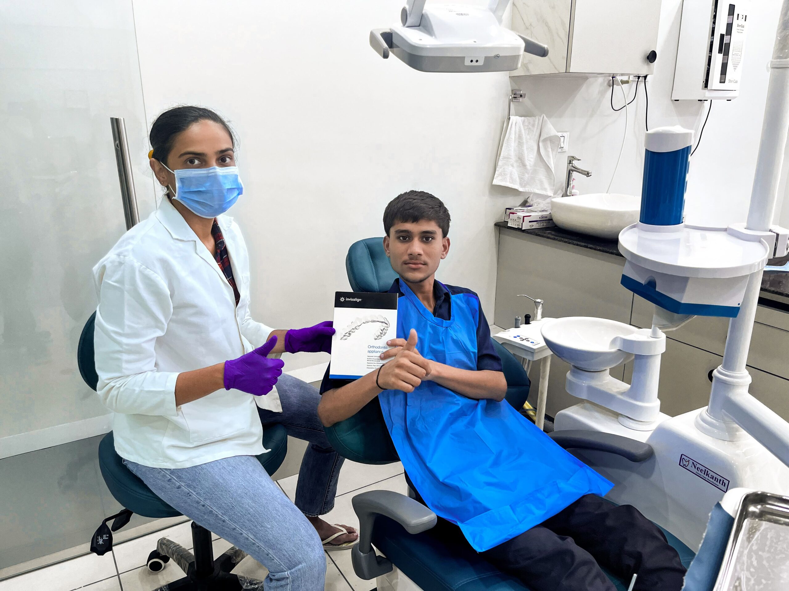 Doctor Treating Patient with Invisalign at MJ Orthodontics